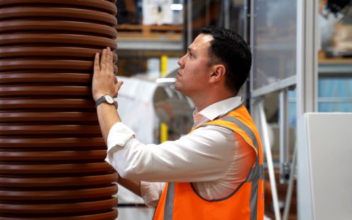 Pipelife's Head of R&D, Konstantinos Akritanakis, inspects the profile of a Pragma pipe..