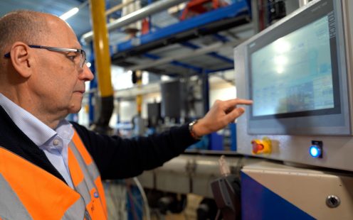 Pipelife's Head of Sustainability, Zoran Davidovski, checks the monitor near a PE extrusion line.