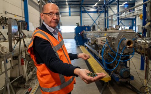 Pipelife's Head of Sustainability, Zoran Davidovski, demonstrates shredded plastic waste.