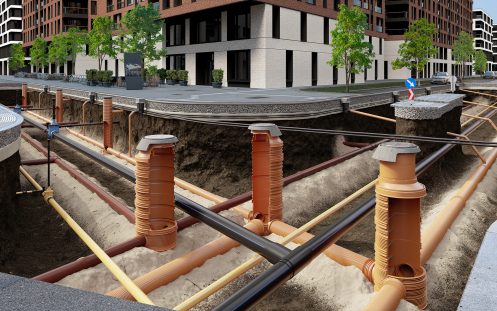 A 3D visualization of an underground wastewater network in an urban area, featuring several manholes and chambers.