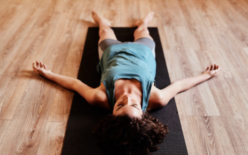 Shot of a group of young woman resting after her yoga session