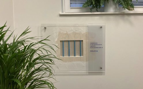 A small fragment of uncovered wall heating panel at Pipelife Poland's office has been left to showcase the system to the clients | Pipelife