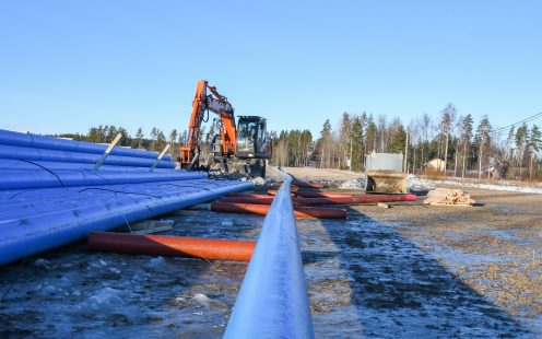 An excavator arranging Pipelife Robust pipes at the installation site | Pipelife