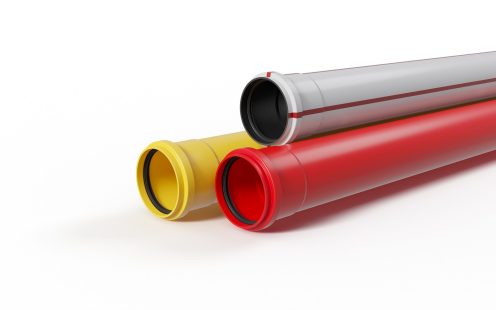 Cable_protection_Yellow_Red_and_White-with-red_stripe_PVC_pipes_stacked.jpg