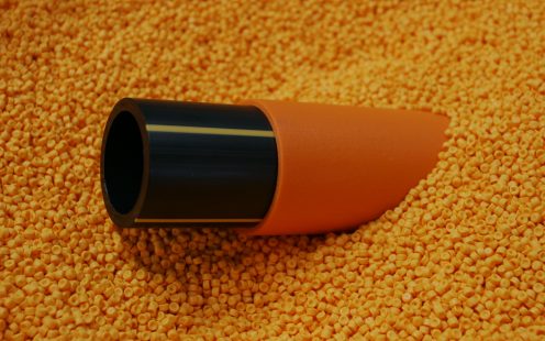 Black and orange gas pipe in raw material