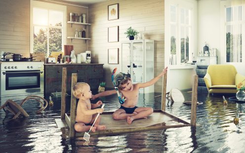 kids pday on the table while flooding in the kitchen. Photo and media photocombination