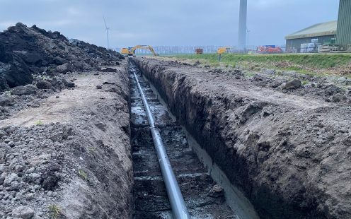 A drainage pipe is being laid in the ground | Pipelife