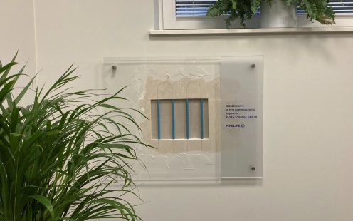 A small fragment of uncovered wall heating panel at Pipelife Poland's office has been left to showcase the system to the clients | Pipelife