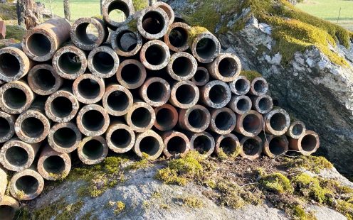 Old clay drainage pipes, left in the woods for storage in 1934 | Pipelife