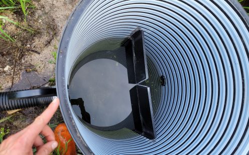 Each well required a mid-wall with a V-notch on top to measure the real-time flow of water | Pipelife