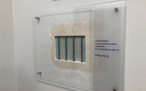 A close-up of uncovered wall heating panel at Pipelife Poland's office | Pipelife