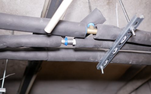 Three multilayer composite water distribution pipes with black insulation layer | Pipelife