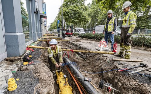 Three installers next to an open trench with a PE gas line and several Polsafe fittings visible | Pipelife