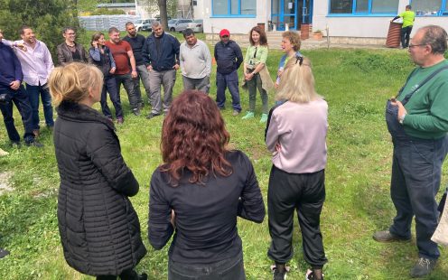 Pipelife Bulgaria's team gathered in front of the plant and listening to a lecturer | Pipelife