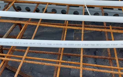 A close up of two Pipelife PE-RT pipes that were used for installing the underfloor heating system at the treatment plant | Pipelife