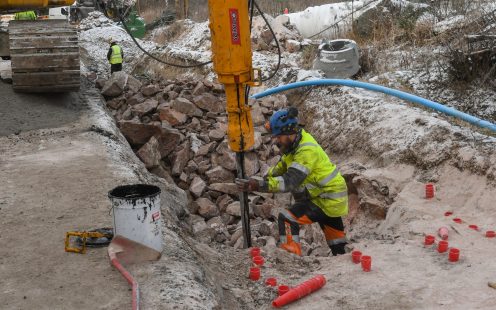 A technician drilling into the bedrock at the installation site | Pipelife