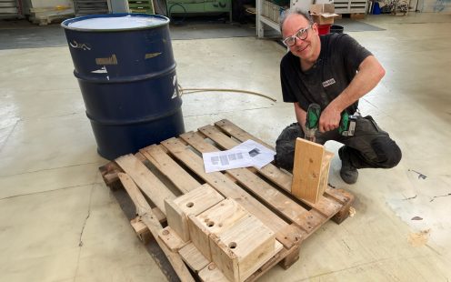 Pipelife Belgium's biodiversity ambassador Patrick Bouckaert, is making bird boxes from used wooden pellets for the company's production site in Seneffe