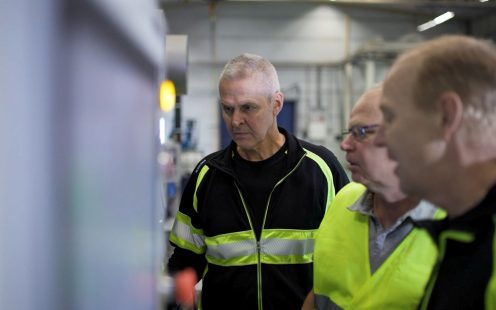 The Ölsremma plant production team standing next to the compounder.