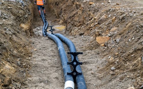 Cable protection pipes in a trench
