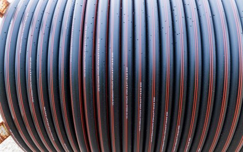 Close-up view of a reel of cable protection pipes