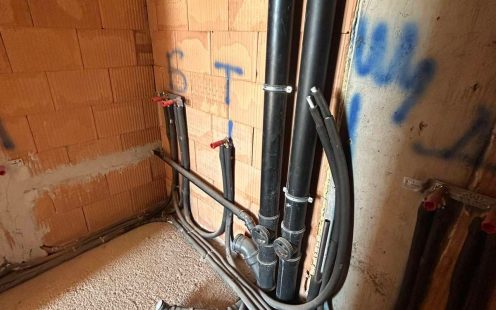 Cable protection pipes in a trench