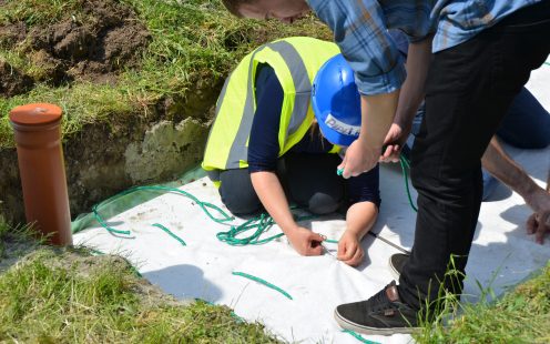 Workers inspect Pipelife's installed stormboxes